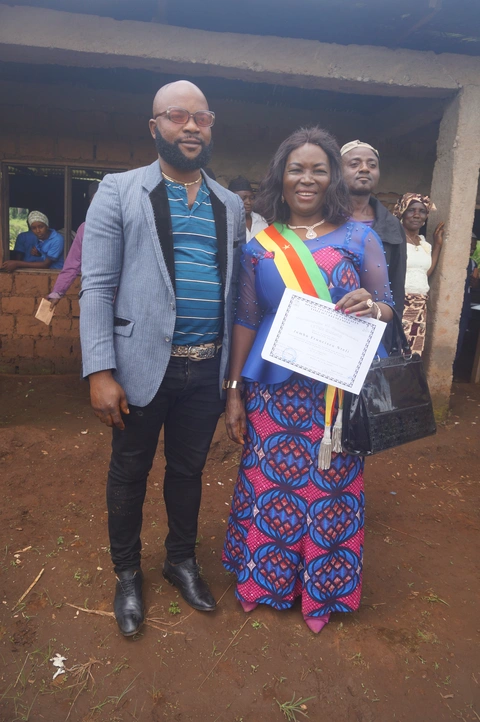 Certificate award to 2nd Deputy mayor. Mm. Nyanda accompanied by Jerry. C